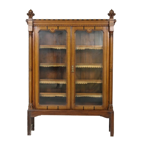 715 - Victorian oak and inlaid Gothic Revival bookcase, circa 1860, having a crenellated and moulded corni... 