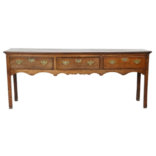 717 - George III oak low dresser, circa 1760-80, having three drawers with moulded edge, brass fretwork sw... 