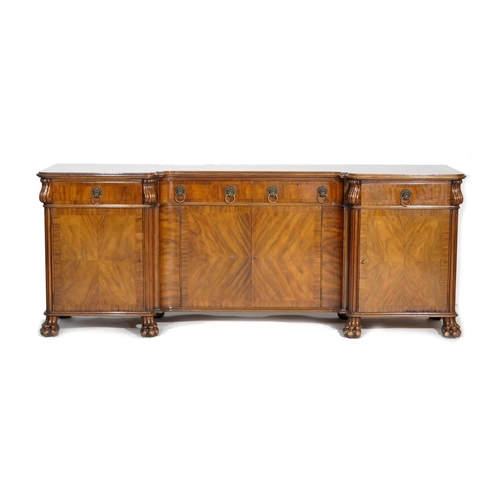 743 - George V walnut inverted breakfront sideboard, circa 1910-30, having four drawers with lion's mask r... 