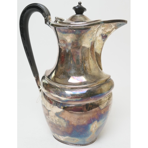 161 - George V silver hot water jug, maker H A, Sheffield 1920, plain baluster form with ebony finial and ... 