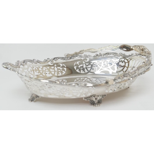 165 - Edwardian silver table basket, by William Hutton & Sons, London 1905, oval form with swing handle, p... 