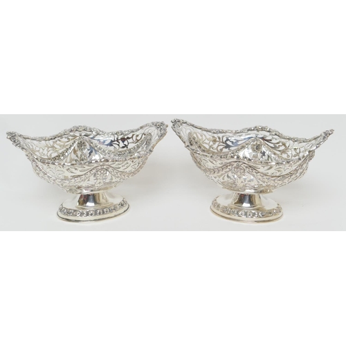 166 - Pair of Edwardian silver footed bonbon dishes, by Nathan & Hayes, Chester 1908/09, each pierced with... 