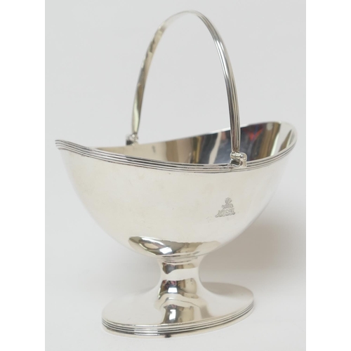 181 - George III silver sugar basket, Maker I.R, London 1798, oval form with reeded edge and swing handle,... 