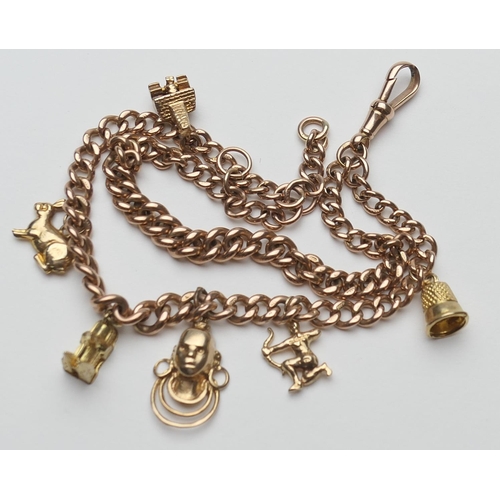 373 - 9ct gold double curb link charm bracelet, with spring clip, supporting five 9ct gold charms and one ... 