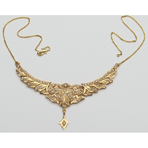 381 - Eastern made yellow gold and pearl necklace, chiselled into a bow form with a triform droplet beneat... 