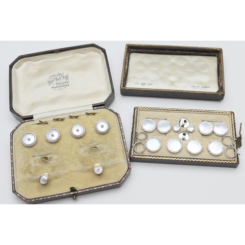 389 - 9ct white gold and mother of pearl cufflink and shirt stud set, boxed; also a box of 9ct two colour ... 