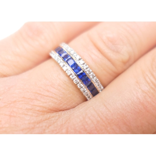 390 - Diamond and sapphire half eternity ring in 18ct yellow gold, channel set with twelve cushion cut sap... 