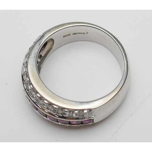 394 - Diamond and ruby half eternity ring in 18ct white gold, channel set with twelve cushion cut rubies b... 