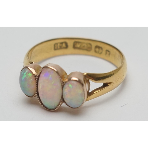 420 - Opal three stone ring, the cabochon opals in beaded collet mounts, later worked on a Victorian 22ct ... 