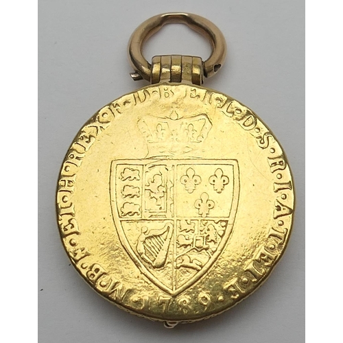 425 - Unusual gold picture locket, formed from two Georgian guineas, enclosing a double picture locket cen... 