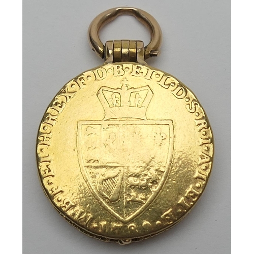 425 - Unusual gold picture locket, formed from two Georgian guineas, enclosing a double picture locket cen... 