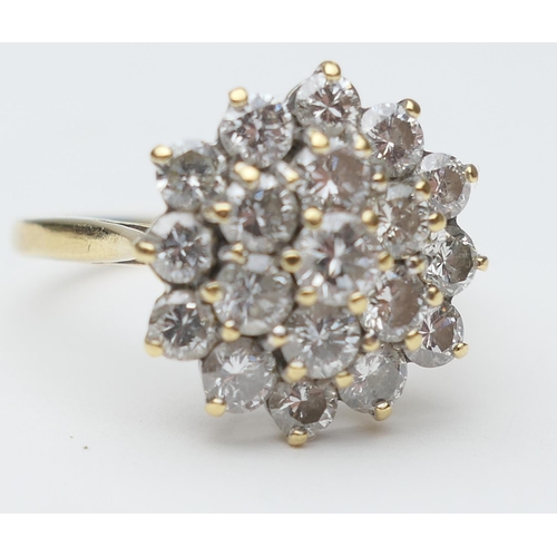 430 - Diamond cluster ring, set with 19 round brilliant cut stones, in a flowerhead stepped 18ct white gol... 