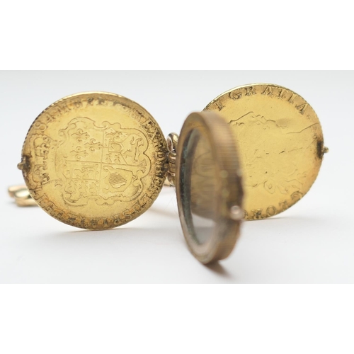 434 - Unusual gold picture locket, formed from two George III guineas, hinged and centred with a locket en... 