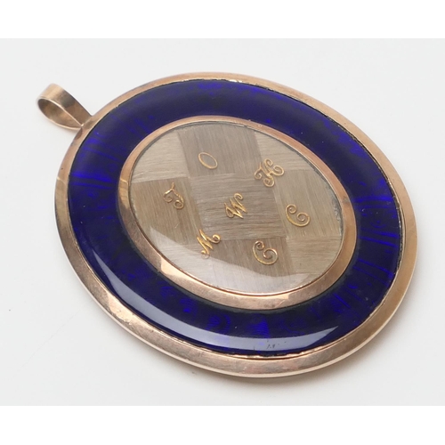 437 - Late George III gold and blue enamelled mourning locket, circa 1790, of large size and centred with ... 