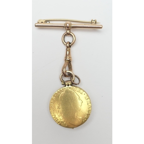 434 - Unusual gold picture locket, formed from two George III guineas, hinged and centred with a locket en... 