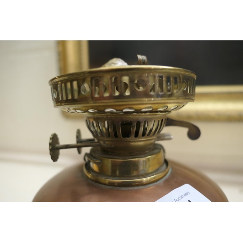 661 - W.A.S. Benson, brass and copper oil lamp, with a frosted spherical shade, copper tank over a brass t... 