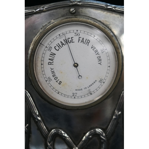 144 - Edwardian silver faced desk barometer, white printed 5cm dial inscribed 'Made in London', set in sil... 