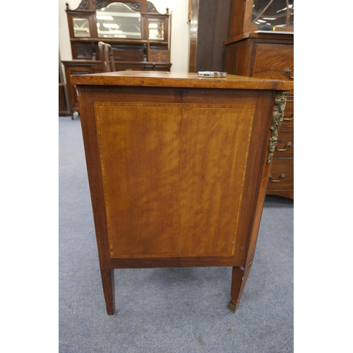 712 - French walnut and satinwood commode, 19th Century, the crossbanded satinwood top 
over three long dr... 