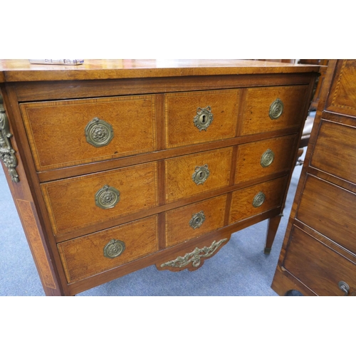 712 - French walnut and satinwood commode, 19th Century, the crossbanded satinwood top 
over three long dr... 