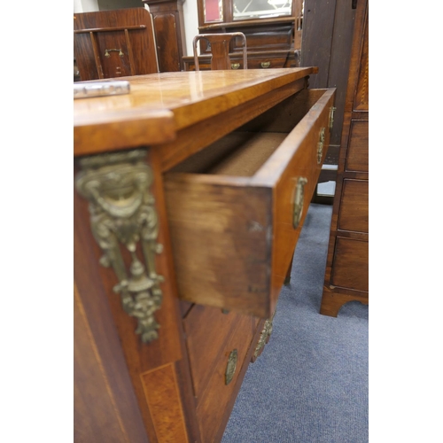 712 - French walnut and satinwood commode, 19th Century, the crossbanded satinwood top 
over three long dr... 