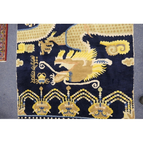 709 - Traditional Chinese woollen pillar rug, 19th Century, having a five toed dragon clutching a flaming ... 