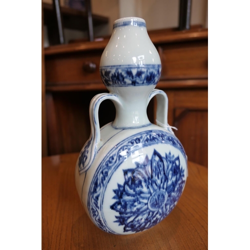 71 - Chinese blue and white bottle vase in the Ming style, 20th Century, flattened double gourd form deco... 