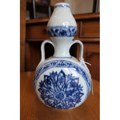 71 - Chinese blue and white bottle vase in the Ming style, 20th Century, flattened double gourd form deco... 