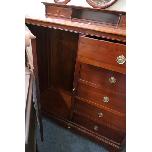 718 - Brigitte Forestier for John Lewis gentleman's cherrywood compactum, surmounted with an oval shaped m... 