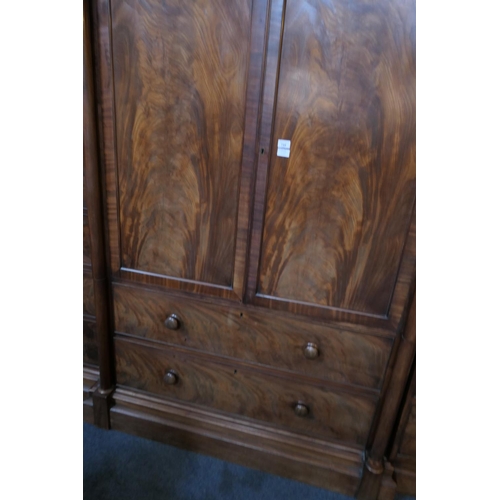 744 - William IV mahogany breakfront press cupboard, circa 1835, centred with two flame mahogany panel doo... 