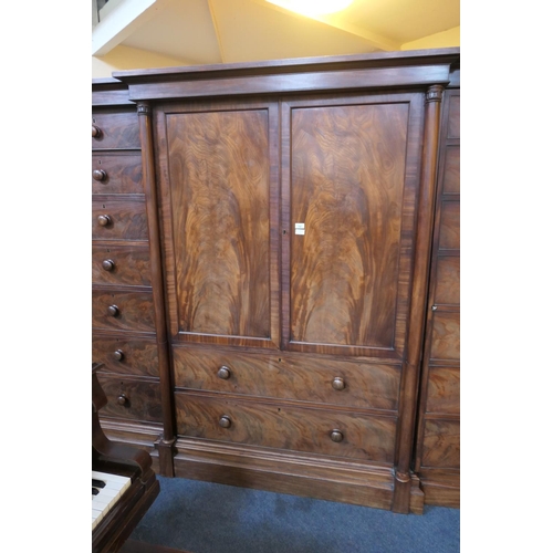 744 - William IV mahogany breakfront press cupboard, circa 1835, centred with two flame mahogany panel doo... 