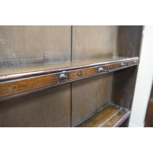 747 - Late George III oak dresser and plate rack, circa 1800, the boarded rack with three shelves and thre... 