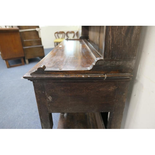 747 - Late George III oak dresser and plate rack, circa 1800, the boarded rack with three shelves and thre... 