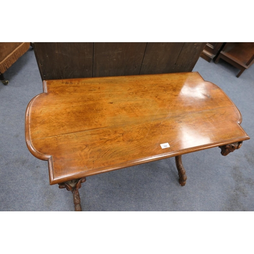 769 - Unusual Continental walnut centre table, circa 1900, the shaped rectangular top raised on curved sup... 