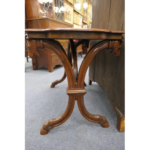 769 - Unusual Continental walnut centre table, circa 1900, the shaped rectangular top raised on curved sup... 