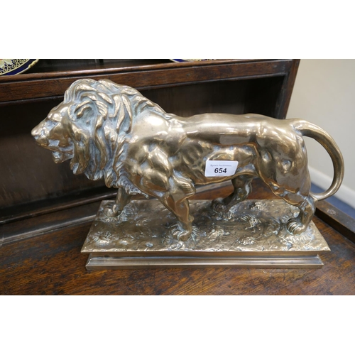 654 - After Barye, a polished bronze sculpture of a lion, the base bearing a signature, height 26cm, lengt... 