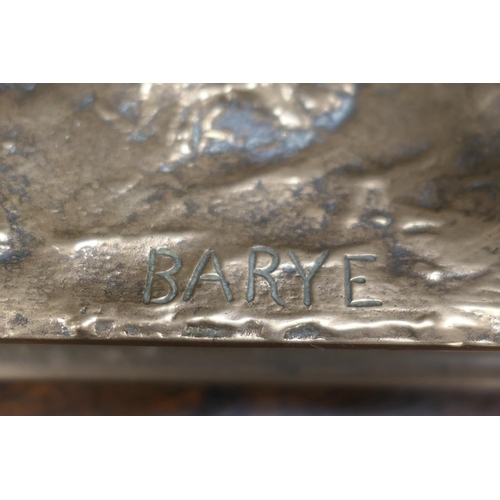 654 - After Barye, a polished bronze sculpture of a lion, the base bearing a signature, height 26cm, lengt... 