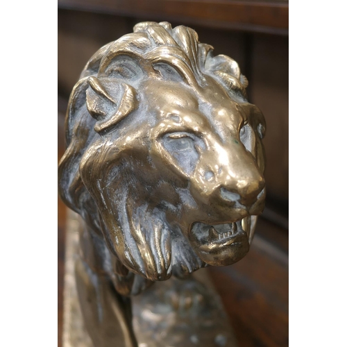 654 - After Barye, a polished bronze sculpture of a lion, the base bearing a signature, height 26cm, lengt... 