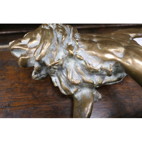 654 - After Barye, a polished bronze sculpture of a lion, the base bearing a signature, height 26cm, lengt... 