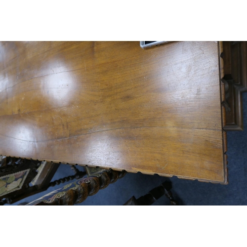 686 - Anglo-Indian walnut refectory table, the elongated rectangular top with moulded edge supported on ba... 