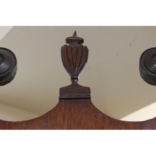 705 - Mahogany glazed freestanding corner cabinet, 19th Century, having a swan neck pediment centred with ... 