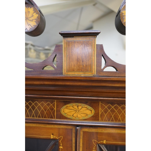 706 - Late George III mahogany and inlaid bookcase cabinet, circa 1790-1810, of small proportions, surmoun... 