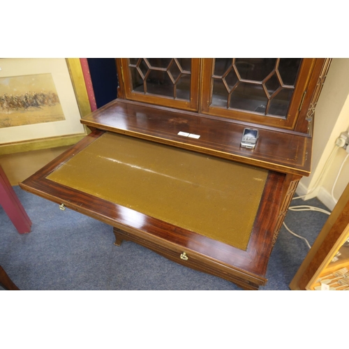 706 - Late George III mahogany and inlaid bookcase cabinet, circa 1790-1810, of small proportions, surmoun... 