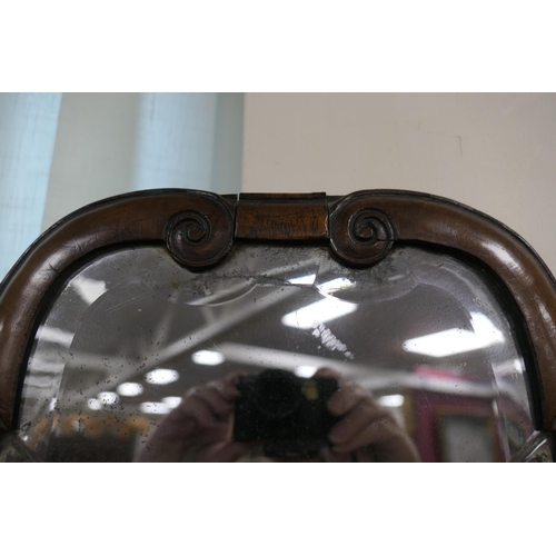 688 - Walnut dressing mirror, early 18th Century, having a shaped bevelled glass plate within a cushion mo... 