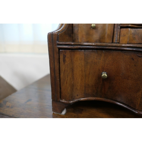 688 - Walnut dressing mirror, early 18th Century, having a shaped bevelled glass plate within a cushion mo... 