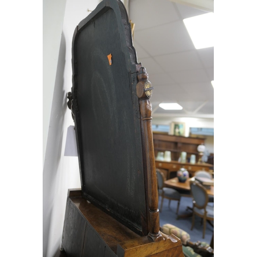 688 - Walnut dressing mirror, early 18th Century, having a shaped bevelled glass plate within a cushion mo... 