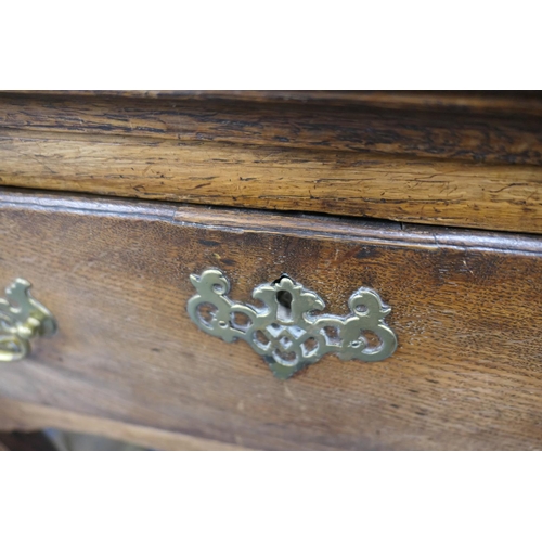 717 - George III oak low dresser, circa 1760-80, having three drawers with moulded edge, brass fretwork sw... 