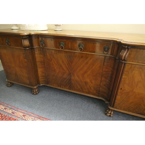 743 - George V walnut inverted breakfront sideboard, circa 1910-30, having four drawers with lion's mask r... 