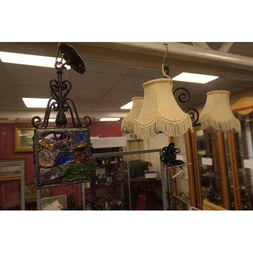 168 - Coloured glass hall lantern and a three branch wrought metal chandelier (2)