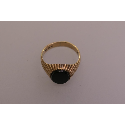 374 - 9ct gold and black onyx signet ring, ring size L, gross weight 3.4g