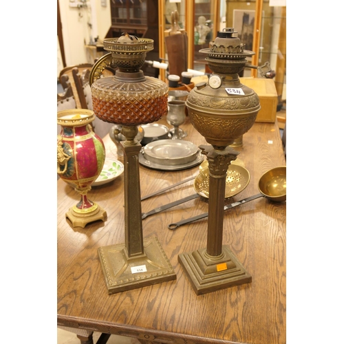 534 - Two Victorian metal pedestal oil lamps